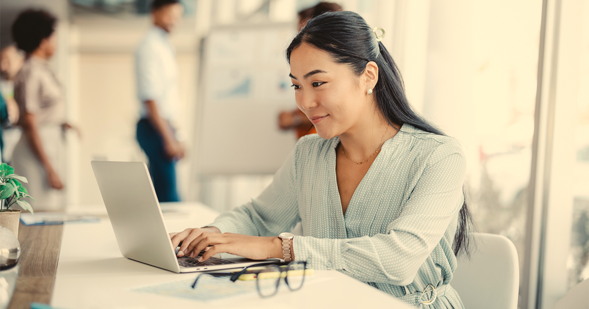 Insurance agent looking at laptop using Vertafore products