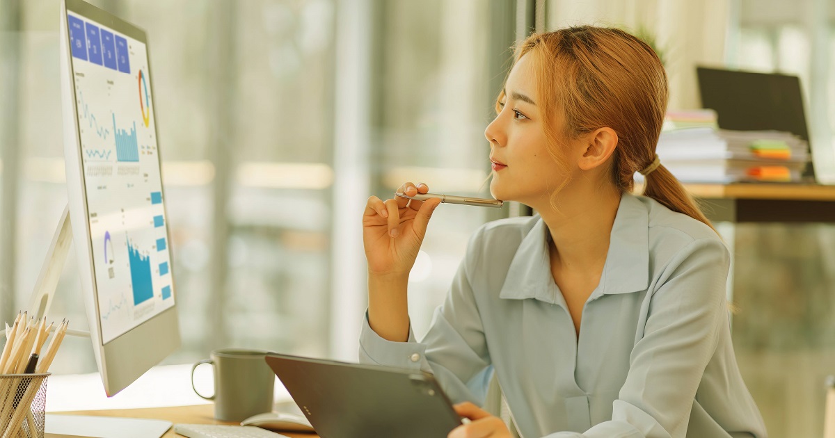 MGA woman leveraging data on computer