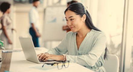 Insurance agent looking at laptop using Vertafore products