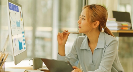 MGA woman leveraging data on computer